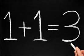 black chalkboard with white chalk writing showing 1+1=3