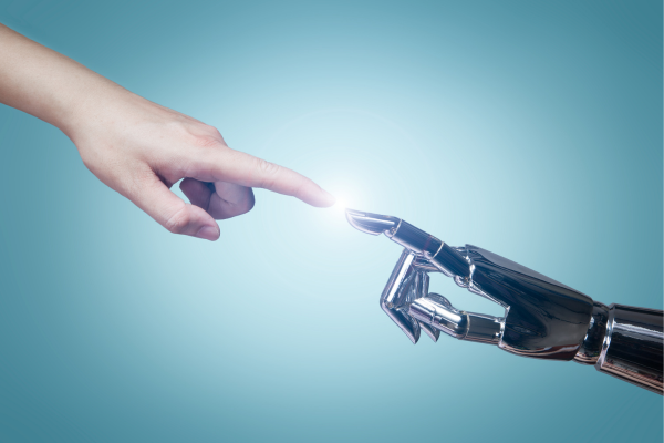 A human hand reaching out to touch the fingertip of a robotic hand, symbolizing the connection between humans and technology. A human hand reaching out to touch the fingertip of a robotic hand, symbolizing the connection between humans and technology.