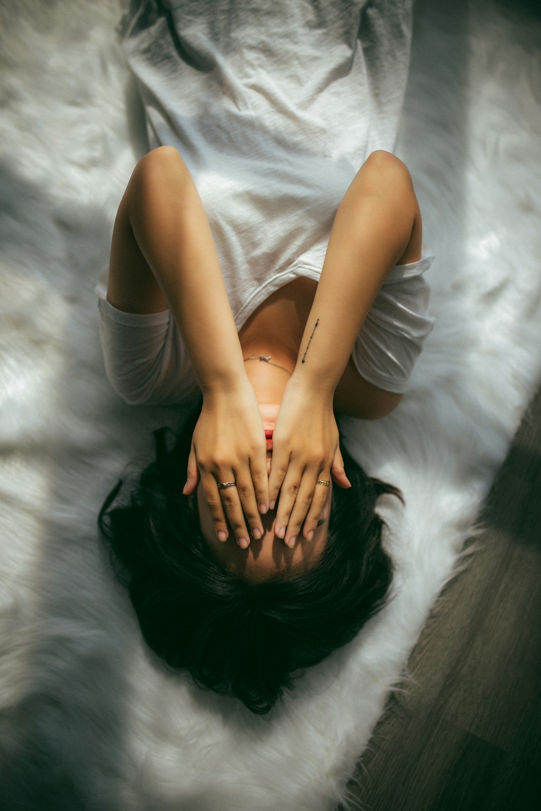 woman covering her face woman covering her face