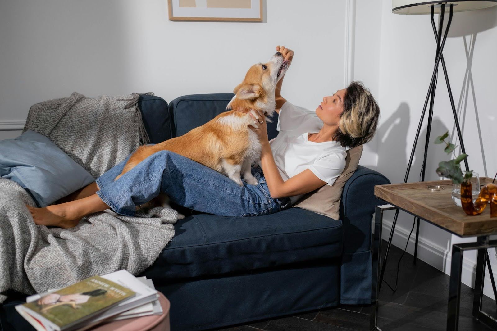 Lady pet owner giving treats to her dog Lady pet owner giving treats to her dog