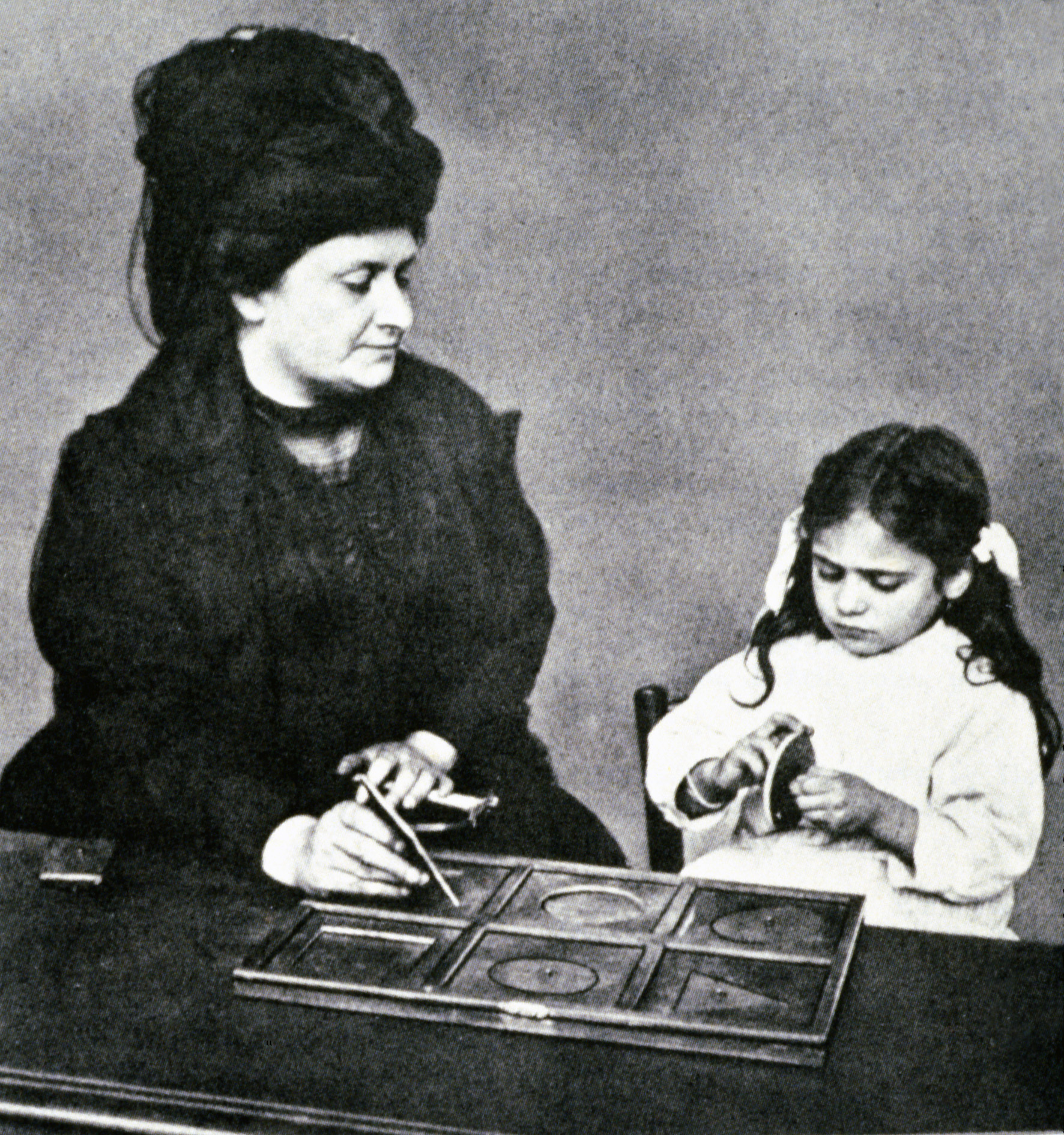 Maria Montessori with a student