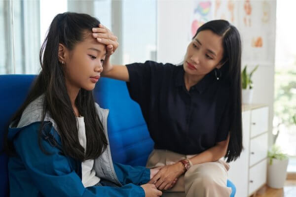 anxious teenager with parent