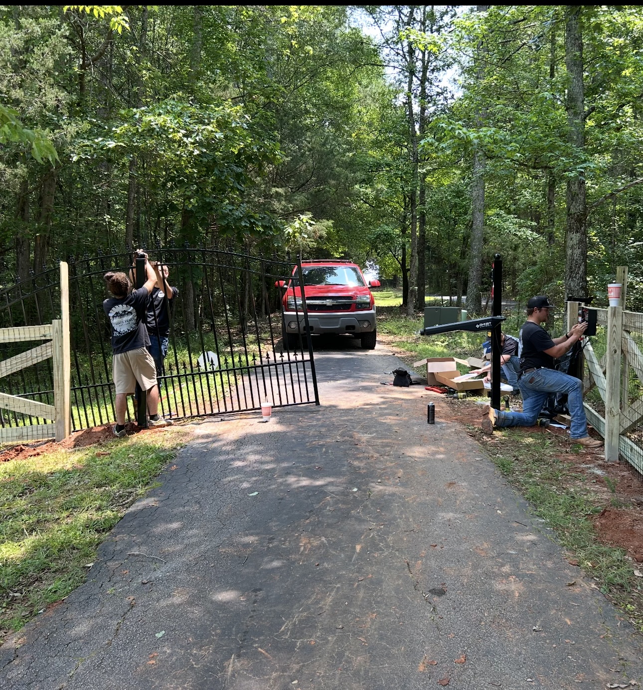 Crew installing fence