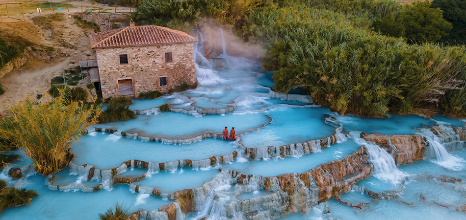 The steamy cascades of Saturnia remain one of Tuscany’s most atmospheric sites. In summer, their early morning mist and dappled afternoon light offer cinematic serenity. The sulphur-rich waters stay around 37.5°C year-round, but the surrounding countryside and vineyard lunches make it a perfect warm-season retreat. The steamy cascades of Saturnia remain one of Tuscany’s most atmospheric sites. In summer, their early morning mist and dappled afternoon light offer cinematic serenity. The sulphur-rich waters stay around 37.5°C year-round, but the surrounding countryside and vineyard lunches make it a perfect warm-season retreat.