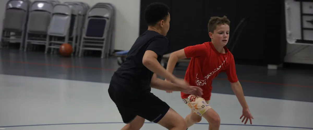 Youth basketball players practicing gameplay drills in Saint Charles Youth basketball players practicing gameplay drills in Saint Charles