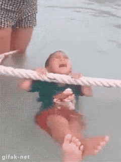 boy panicking in shallow water boy panicking in shallow water