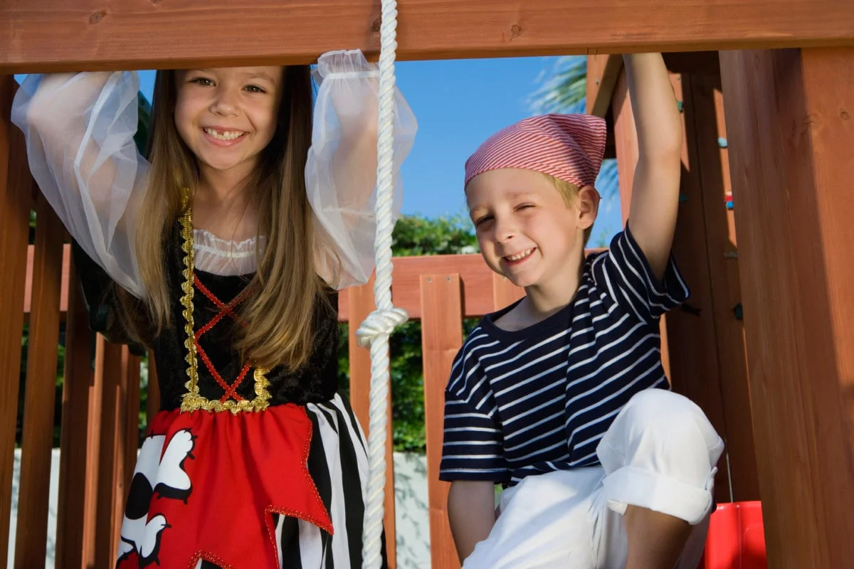 kids in pirate outfits on a playground kids in pirate outfits on a playground