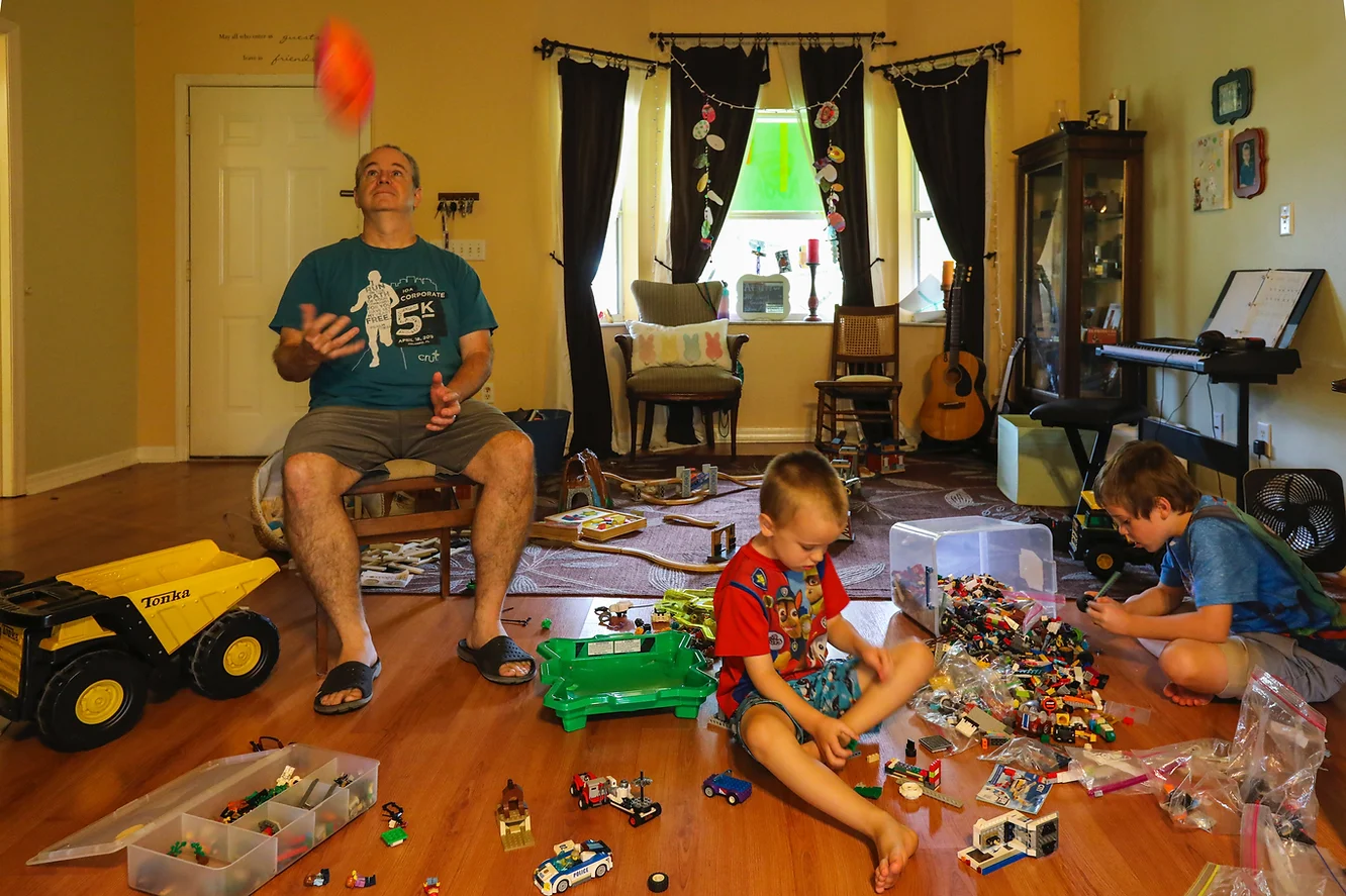 Dad playing with sons
