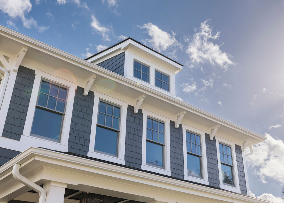 a house with lots of windows with white frames