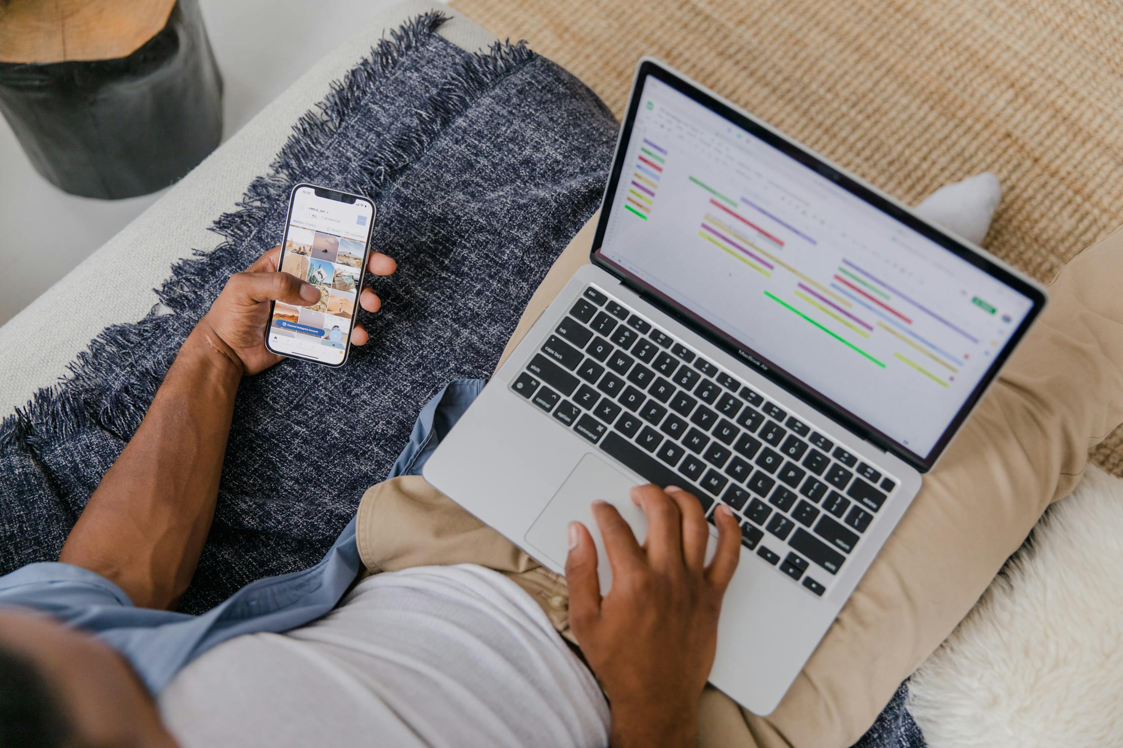 person with smartphone and laptop - content marketing in assets