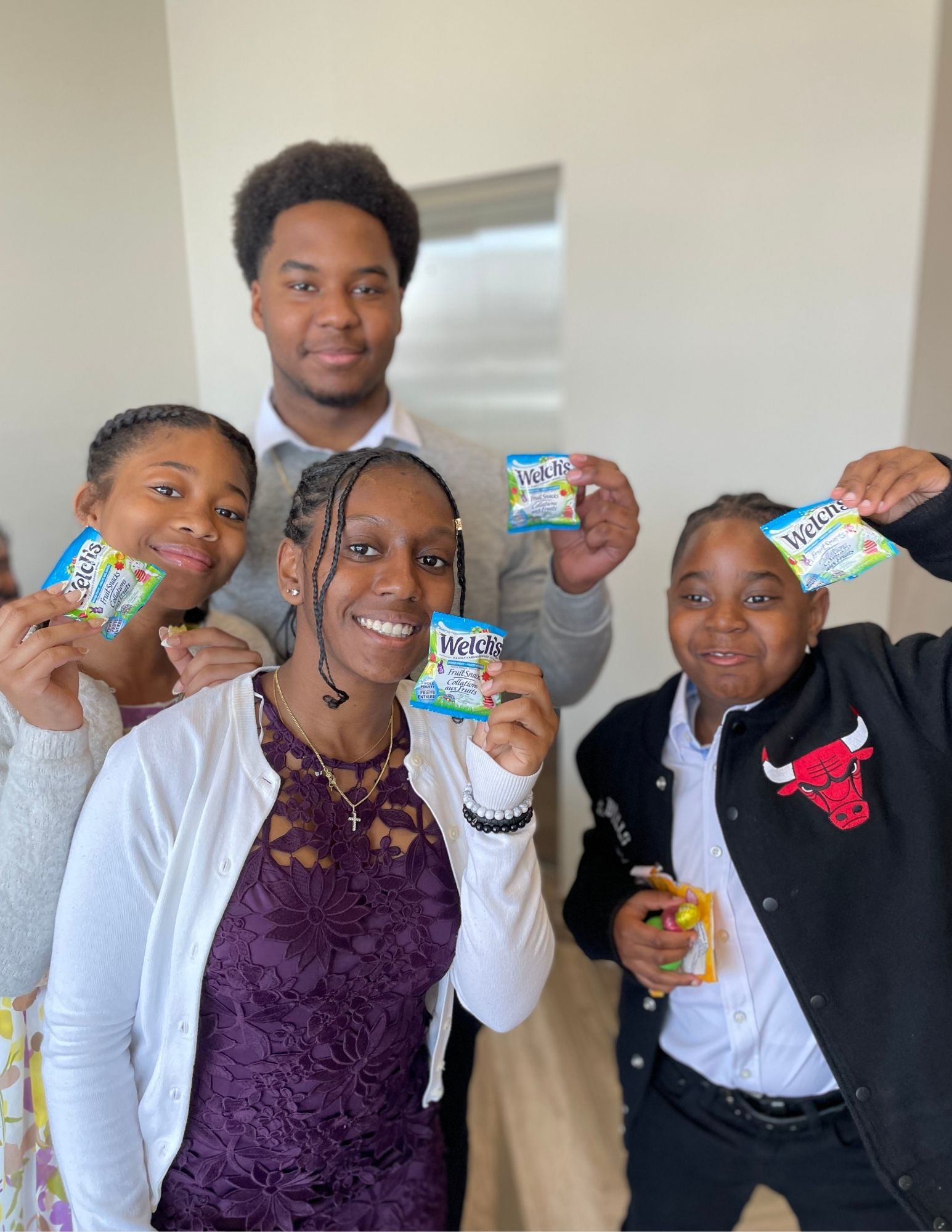 A group of kids holding a candy A group of kids holding a candy