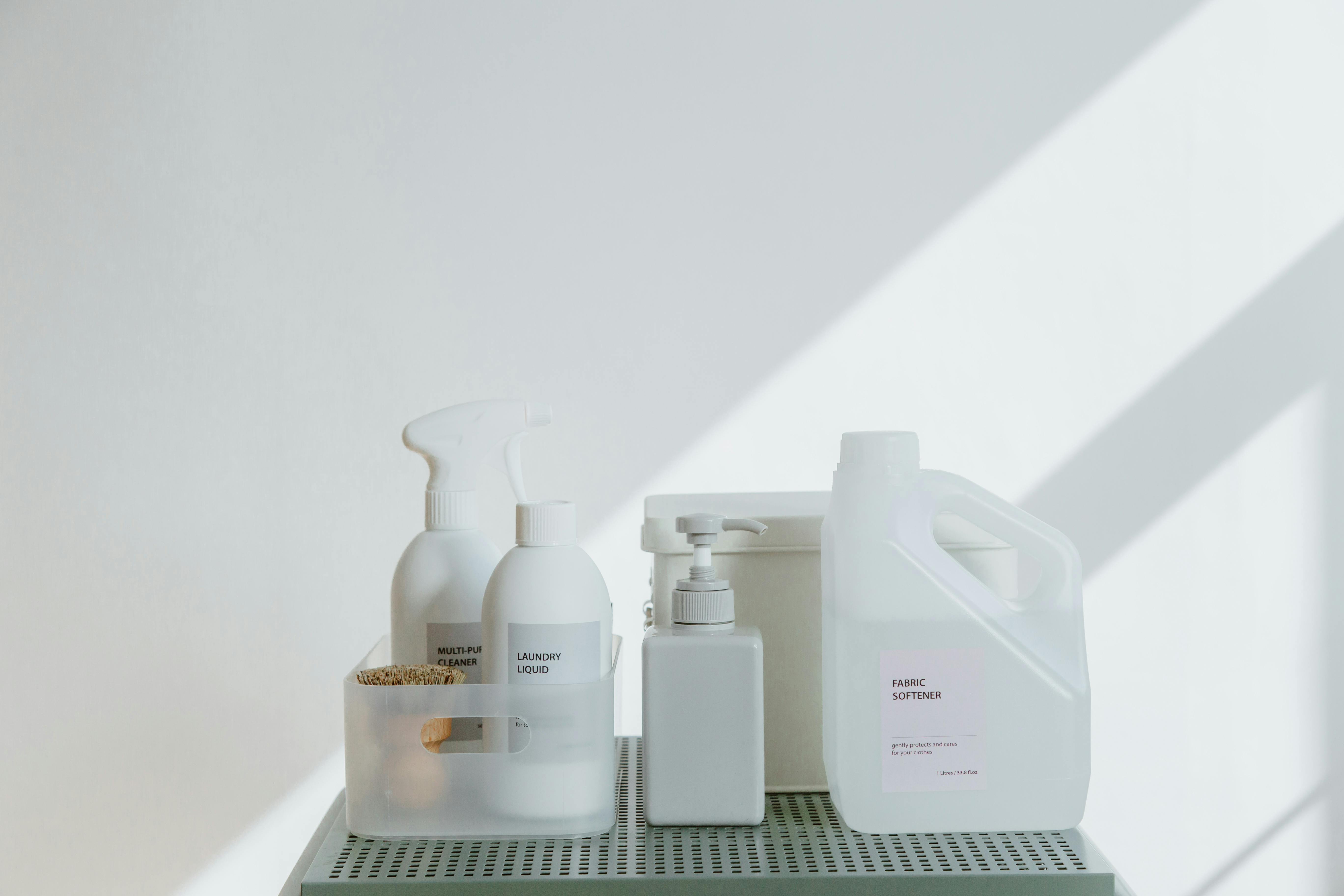 Cleaning Products and Hand Sanitizer Against White Wall Cleaning Products and Hand Sanitizer Against White Wall
