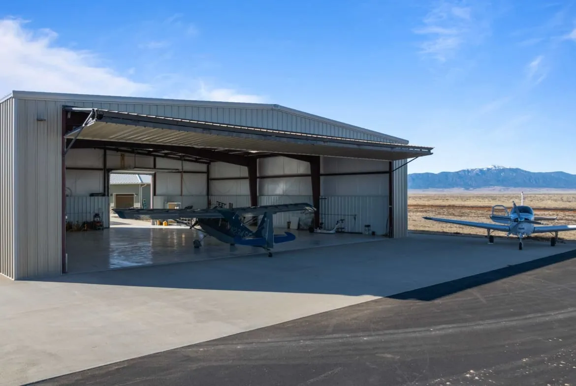 Flying D Ranch aviation estate featuring a luxury home, private hangar, and paved runway set in a scenic landscape — inspiration for Muslimfin Family Office’s South African aviation estate vision. Flying D Ranch aviation estate featuring a luxury home, private hangar, and paved runway set in a scenic landscape — inspiration for Muslimfin Family Office’s South African aviation estate vision.