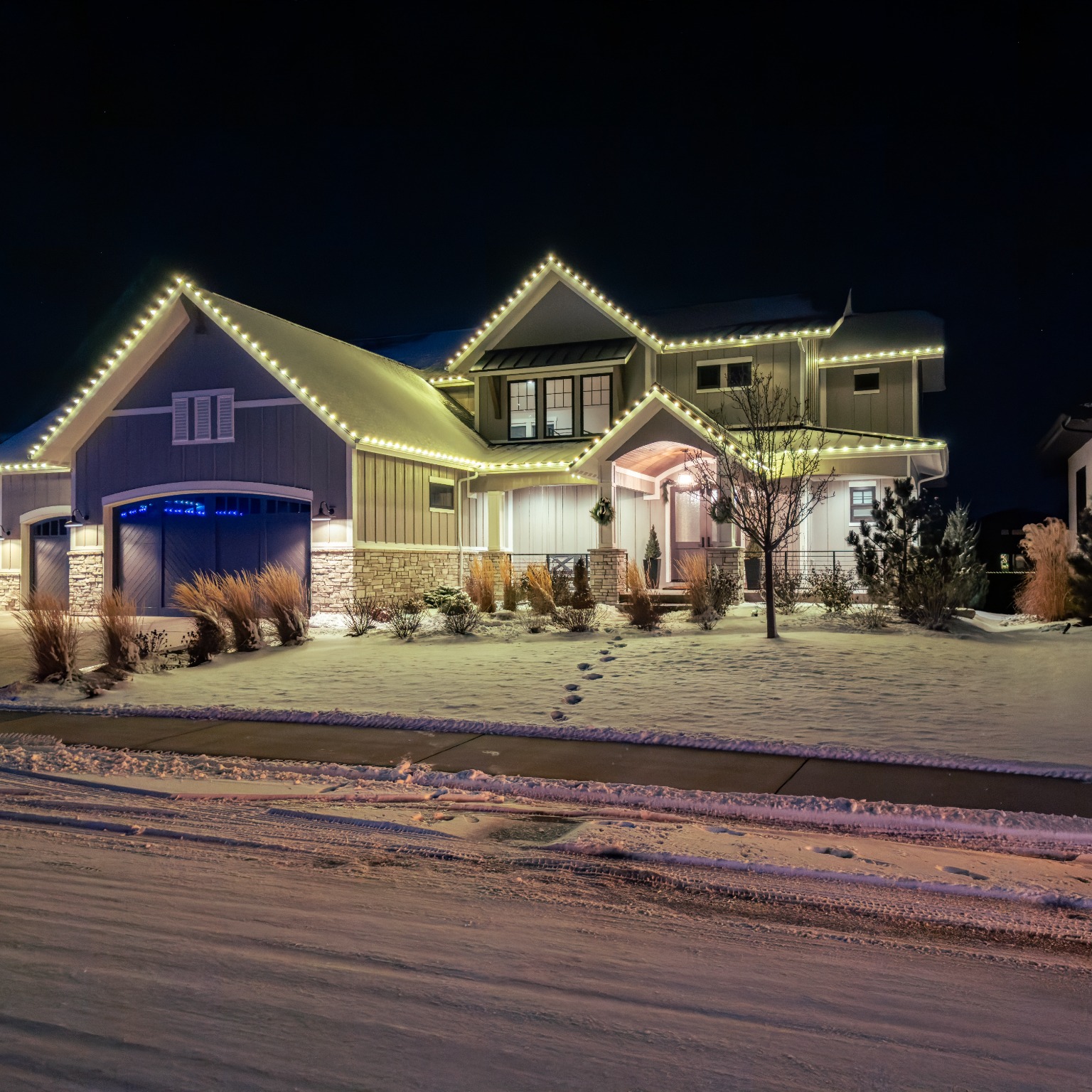 Professional warm white Christmas light installation on Colorado home