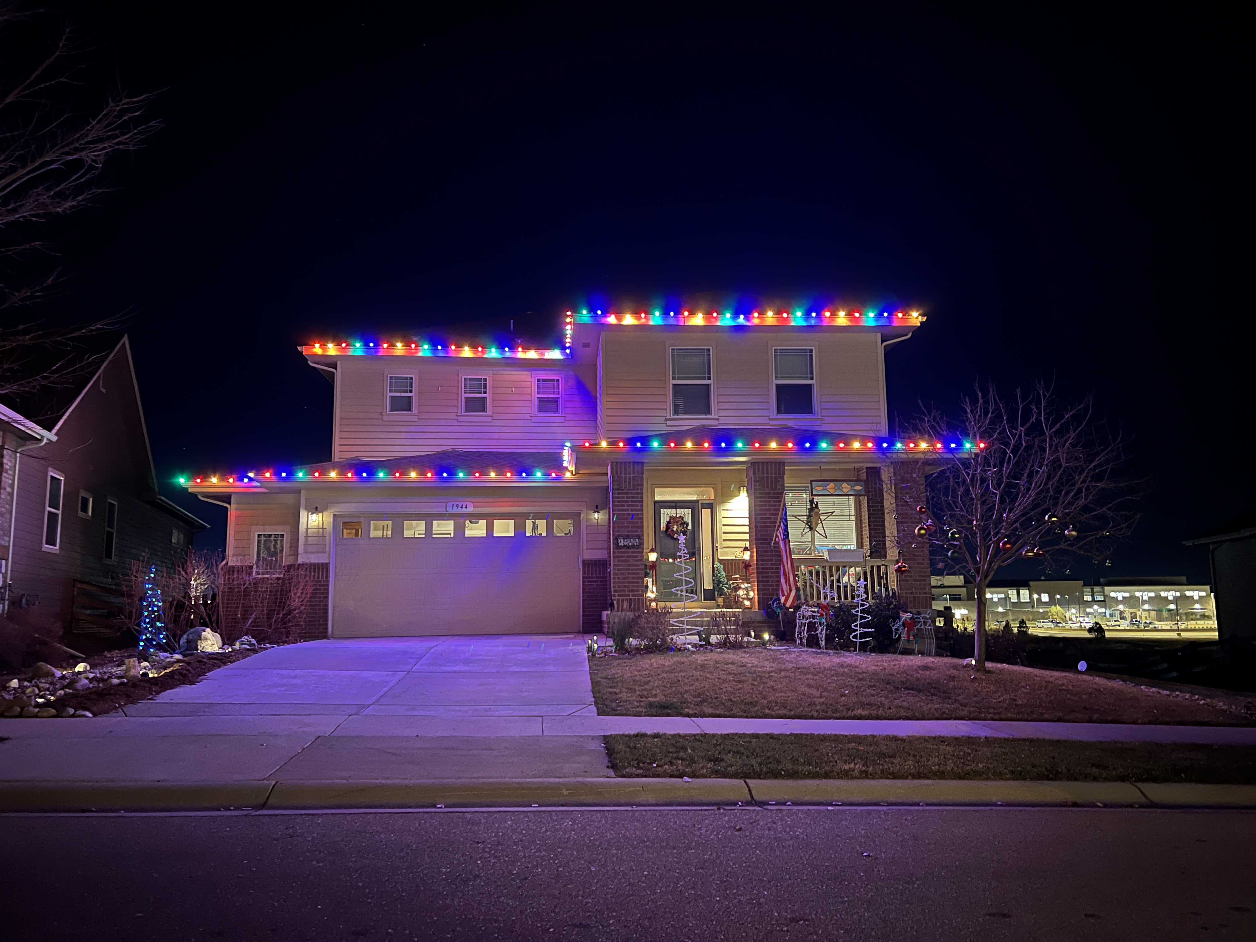Bright multi-color Christmas light installation in Loveland using premium commercial-grade C9 bulbs for colorful holiday home lighting