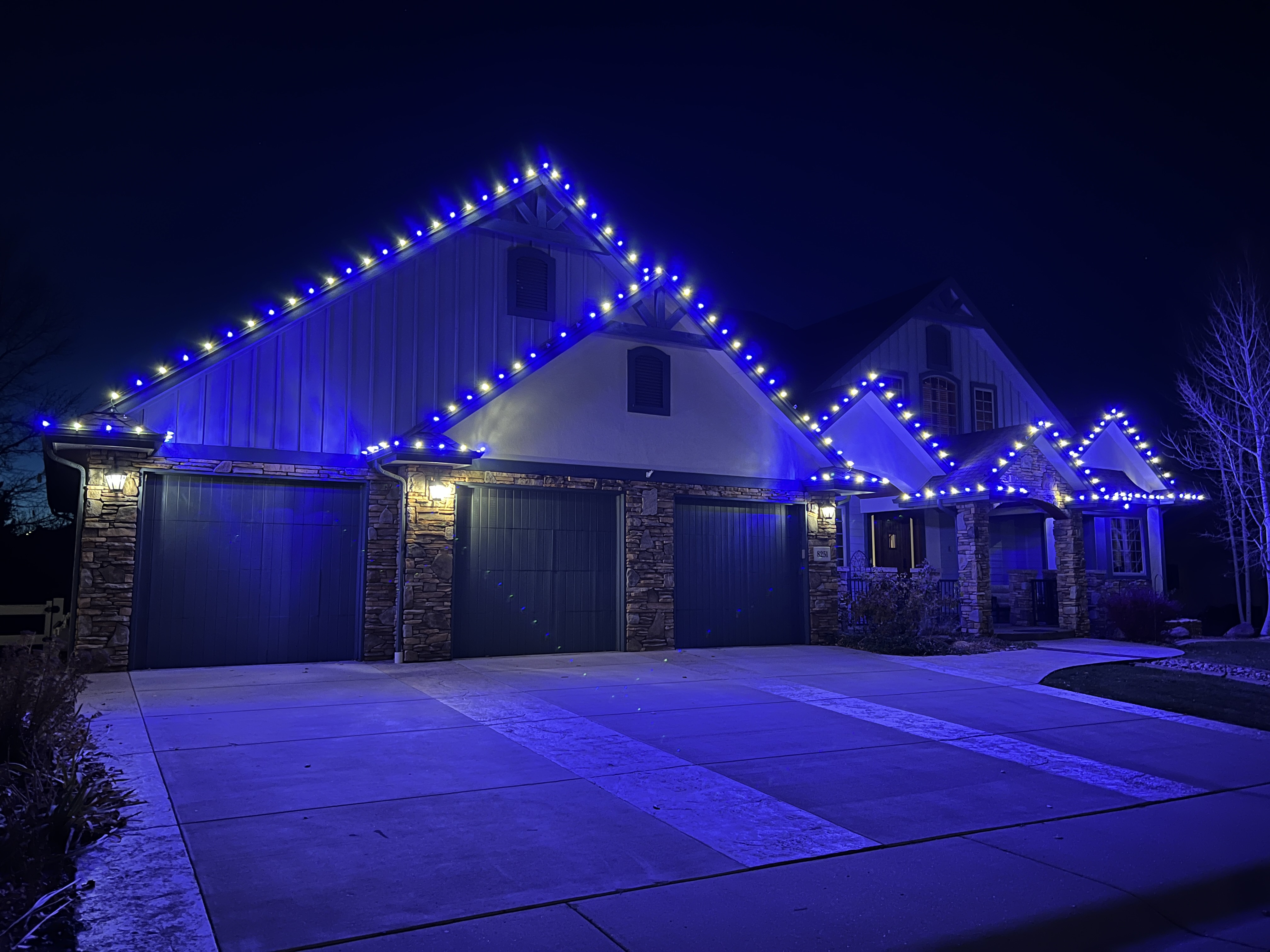 Warm white and blue Christmas light installation in Windsor using premium commercial-grade C9 bulbs for unique holiday home lighting