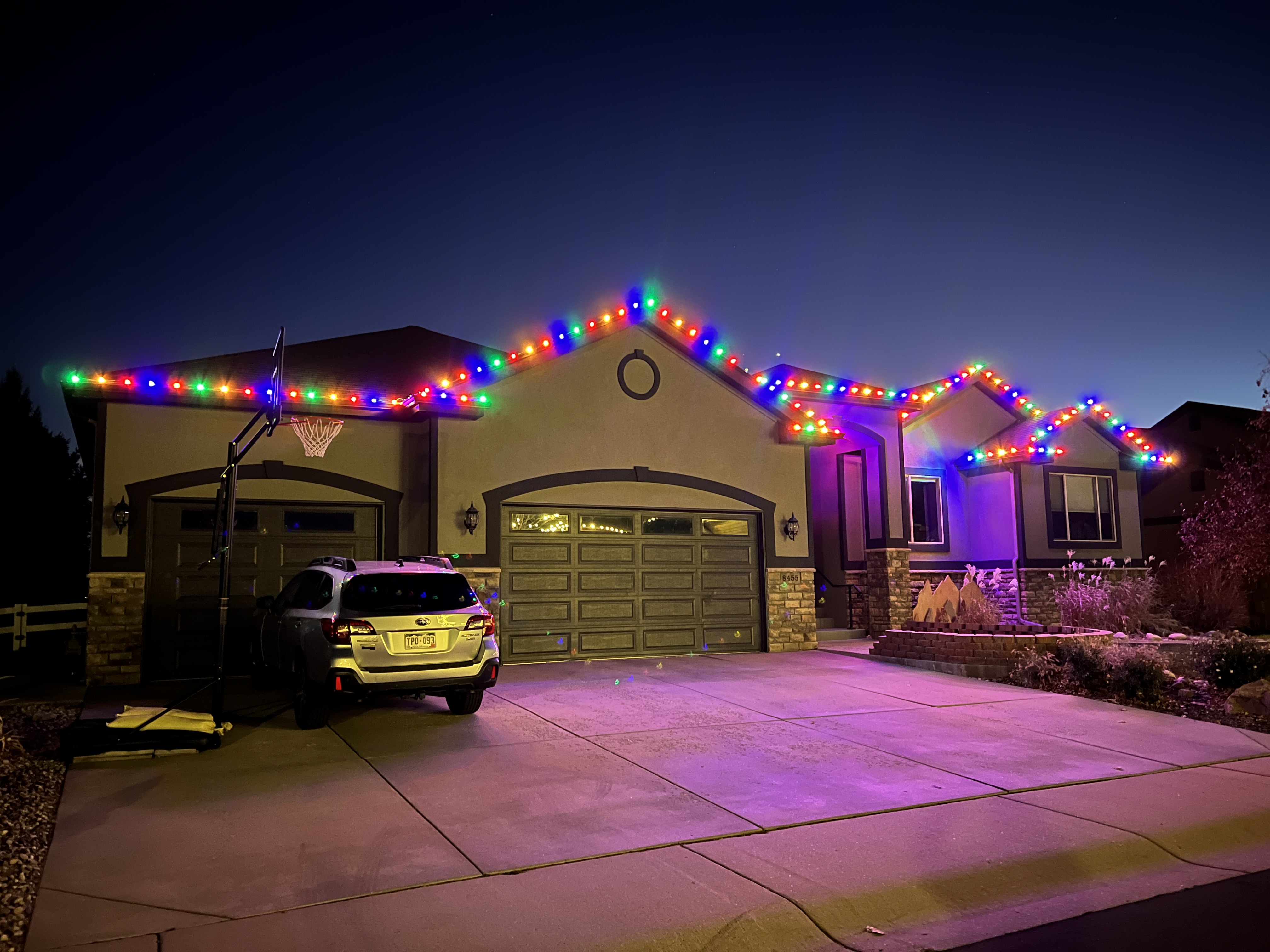 Professional multi-color C9 Christmas light installation on a Windsor residence