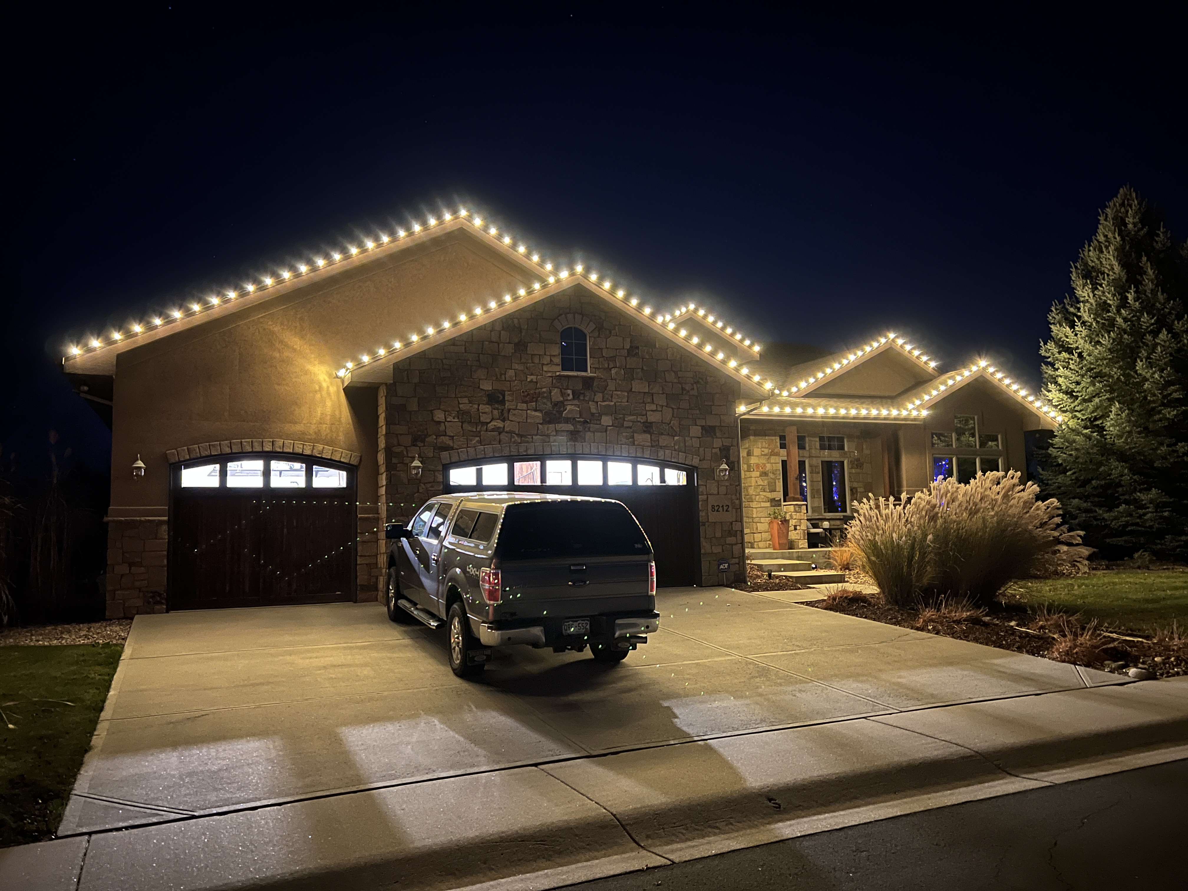 Custom warm white Christmas light design installation