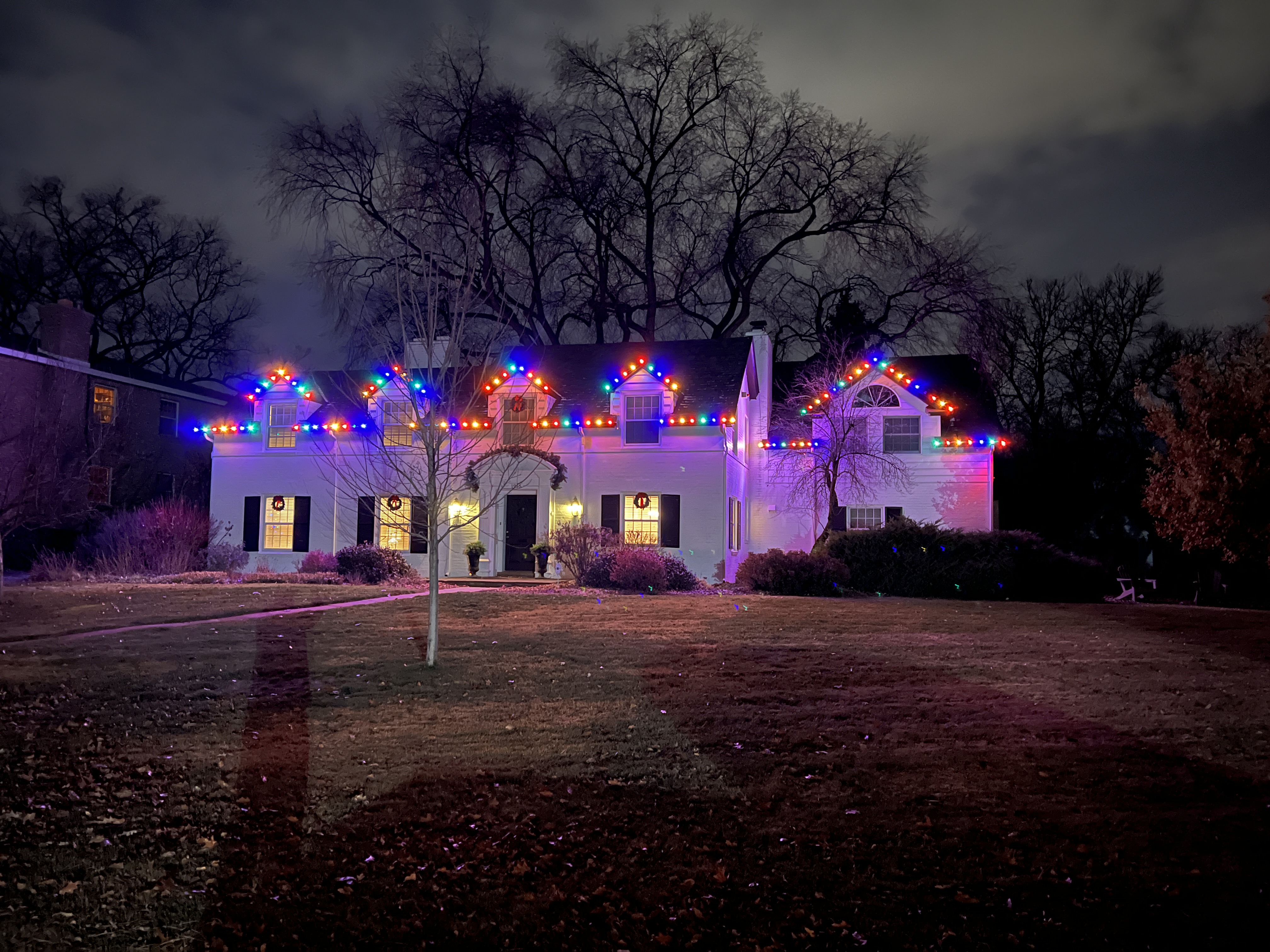 Bright multi-color C9 Christmas light installation on a Greeley residence