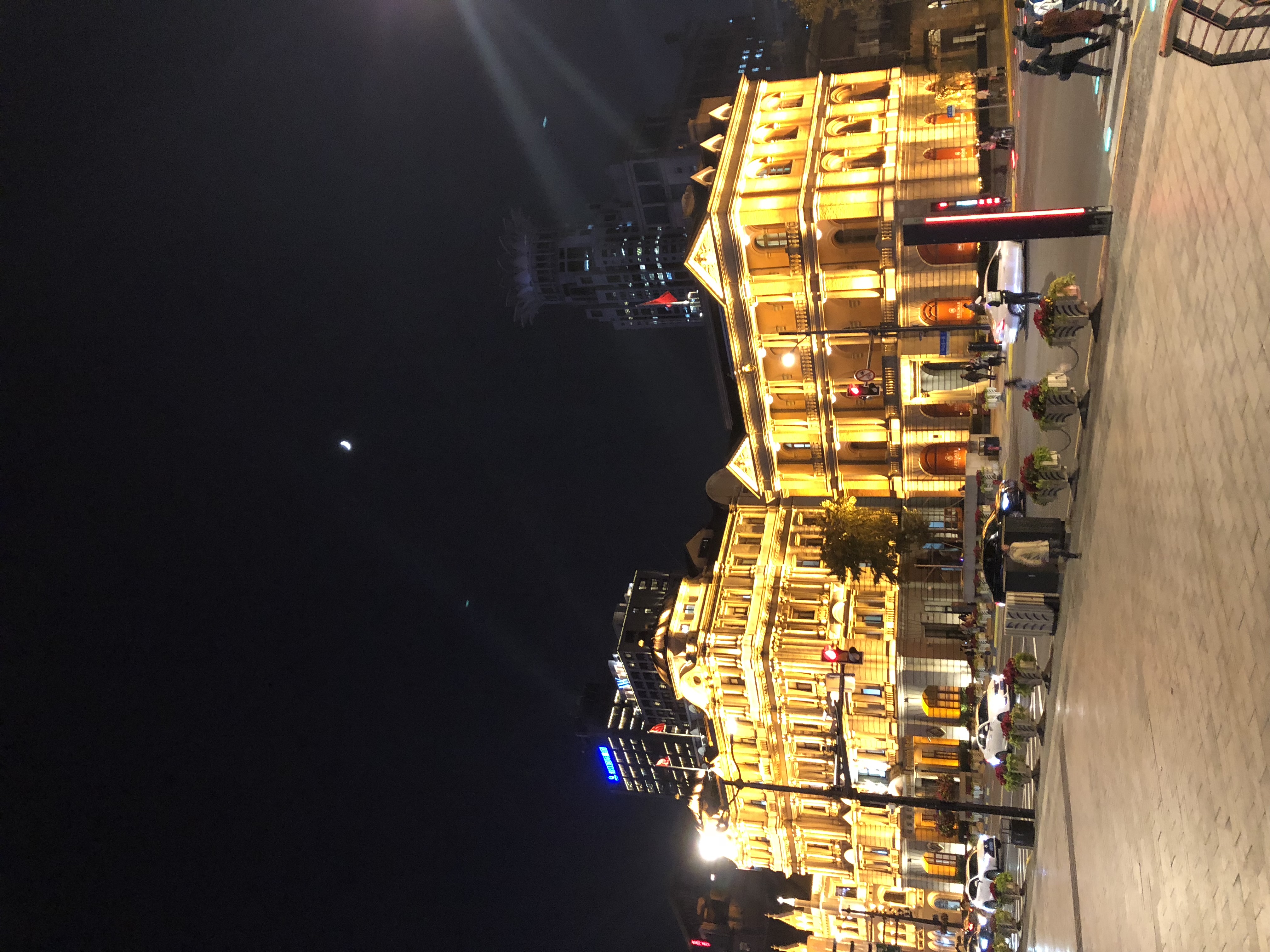 Historic buildings glowing at night along the Bund in Shanghai, a key stop on transformational China journeys for women 45+.
