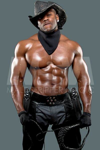 Black male stripper Onyx wearing black cowboy hat, no shirt, biting bottom lip, muscular abs