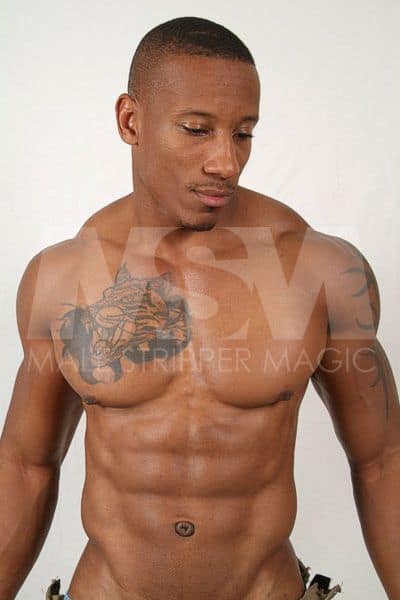 Black male stripper Dante shirtless, posing for a modeling photoshoot