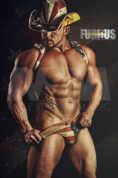 Male stripper Sebastian as a rugged cowboy, only wearing American flag underwear and American flag cowboy hat