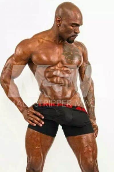 Black male stripper Swagg photo shoot, oiled up, shirtless, muscular with abs