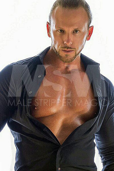 Male stripper Sebastian wearing a black dress shirt unbuttoned, showing chest