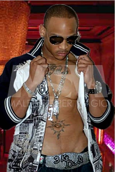 Black male stripper Temptation dressed stylishly with sunglasses, chains, and a jacket opened up to see chest and abs