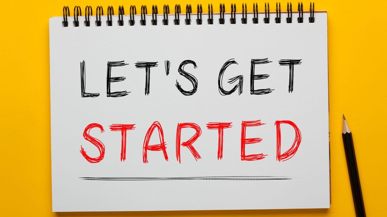 Notebook with 'Let's Get Started' written, representing Quick Assist onboarding or remote support setup Notebook with 'Let's Get Started' written, representing Quick Assist onboarding or remote support setup