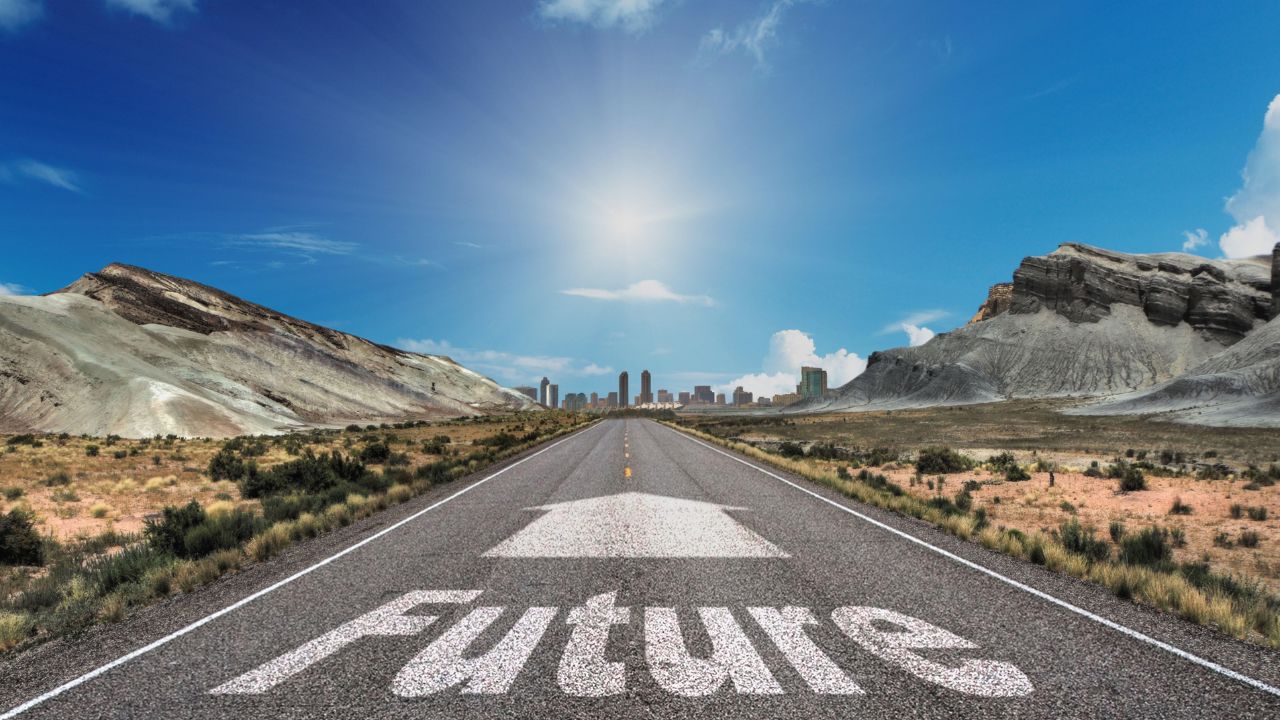 Open highway leading to futuristic city skyline under blue sky, symbolizing future planning and strategic foresight. Open highway leading to futuristic city skyline under blue sky, symbolizing future planning and strategic foresight.