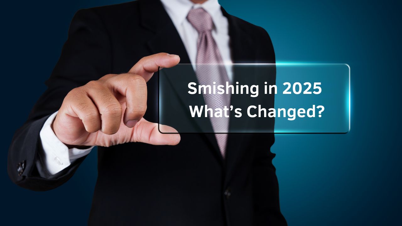 Businessman holding transparent panel showing the text 'Smishing in 2025: What’s Changed? Businessman holding transparent panel showing the text 'Smishing in 2025: What’s Changed?