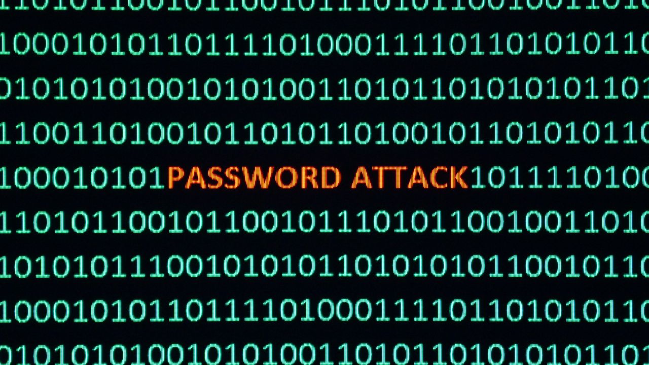 Binary code with highlighted 'PASSWORD ATTACK' representing cyber threats like smishing and phishing Binary code with highlighted 'PASSWORD ATTACK' representing cyber threats like smishing and phishing