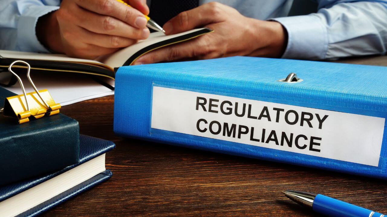 Regulatory compliance binder on desk representing AI regulation and documentation practices. Regulatory compliance binder on desk representing AI regulation and documentation practices.