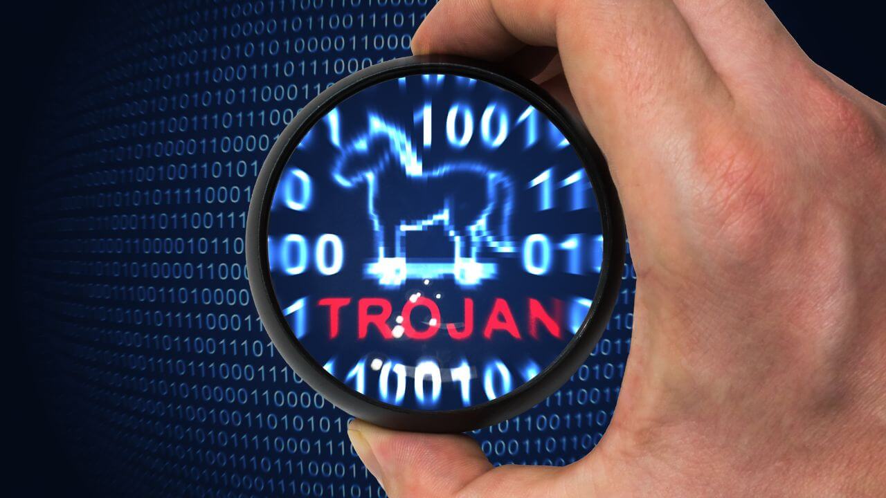Magnifying glass highlighting a digital Trojan horse to depict behavior-based malware detection in cybersecurity. Magnifying glass highlighting a digital Trojan horse to depict behavior-based malware detection in cybersecurity.