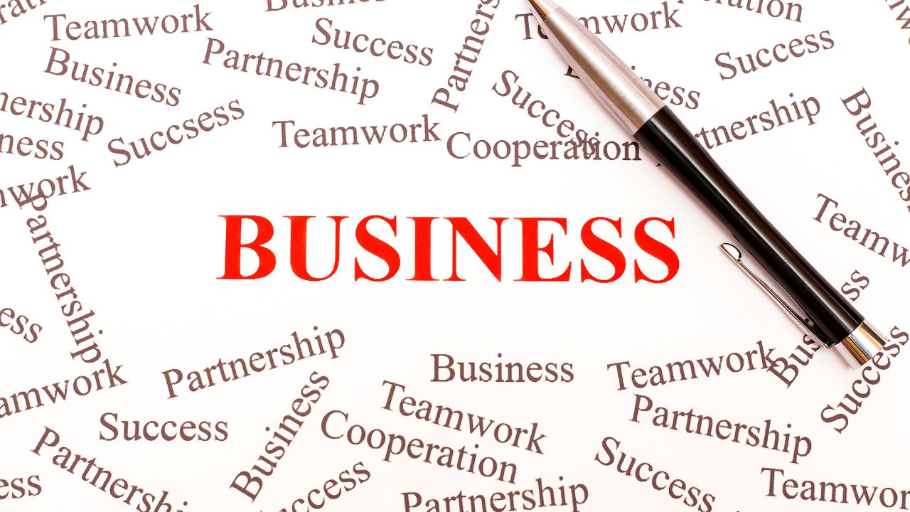 Word cloud with 'Business' in red surrounded by terms like teamwork, success, and partnership. Word cloud with 'Business' in red surrounded by terms like teamwork, success, and partnership.