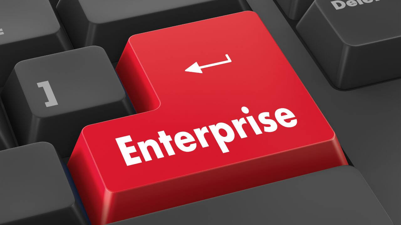 Red enterprise key on computer keyboard representing corporate firewall strategy and IT infrastructure. Red enterprise key on computer keyboard representing corporate firewall strategy and IT infrastructure.