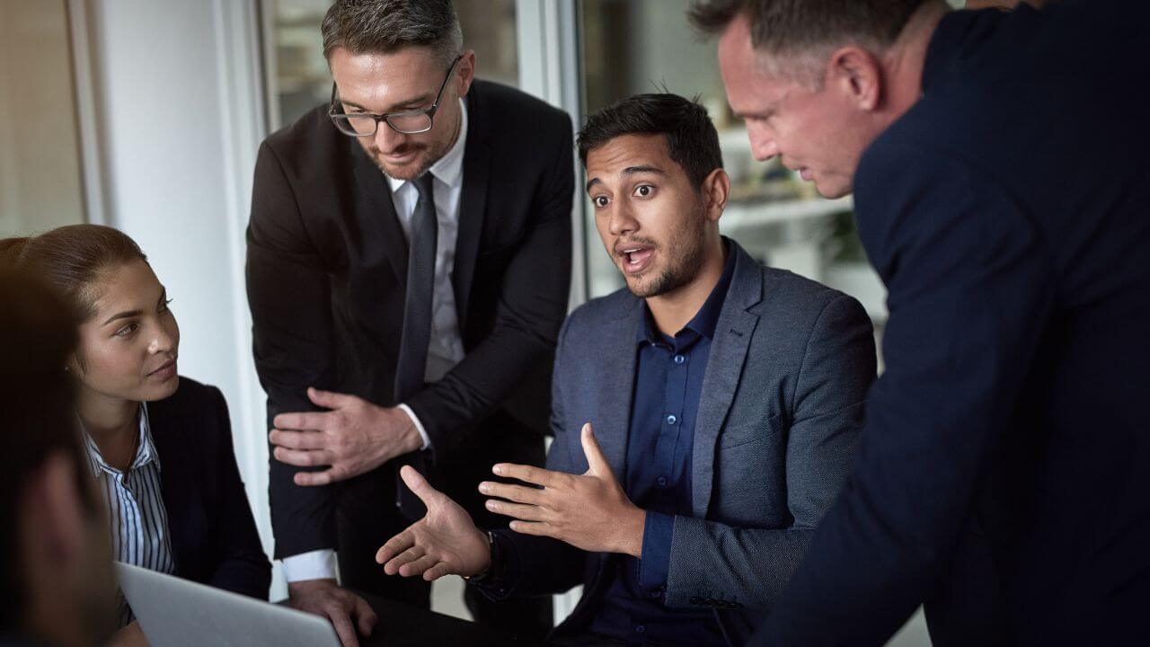 Business team discussing limitations of generative AI in corporate strategy meeting. Business team discussing limitations of generative AI in corporate strategy meeting.