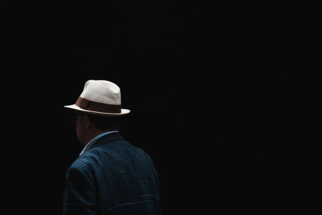 Man Walking with Fedora Hat
