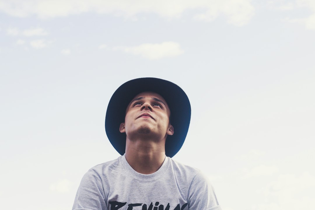 Man looking up showing brim of fedora hat