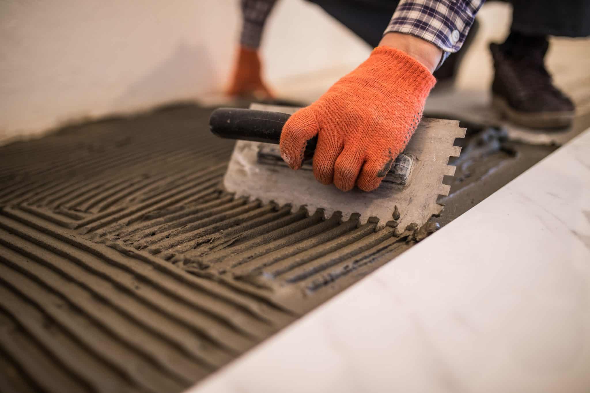 Expert contractor performing a flooring job