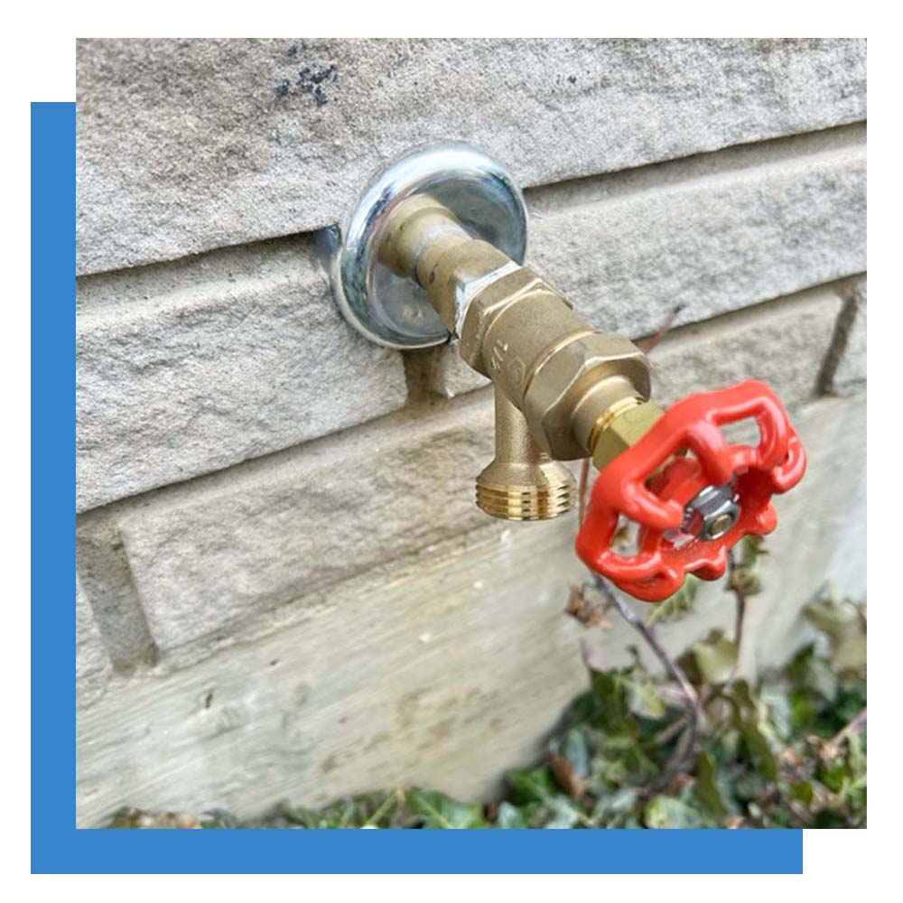 Hose bib on outside wall of a house. Hose bib on outside wall of a house.