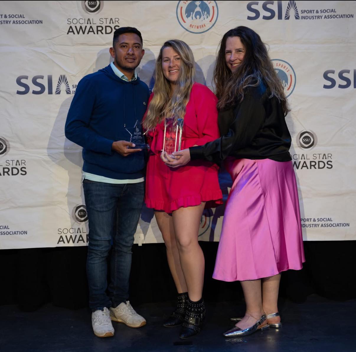 Alli, Andres, and Rebecca celebrating Striker's shining moment