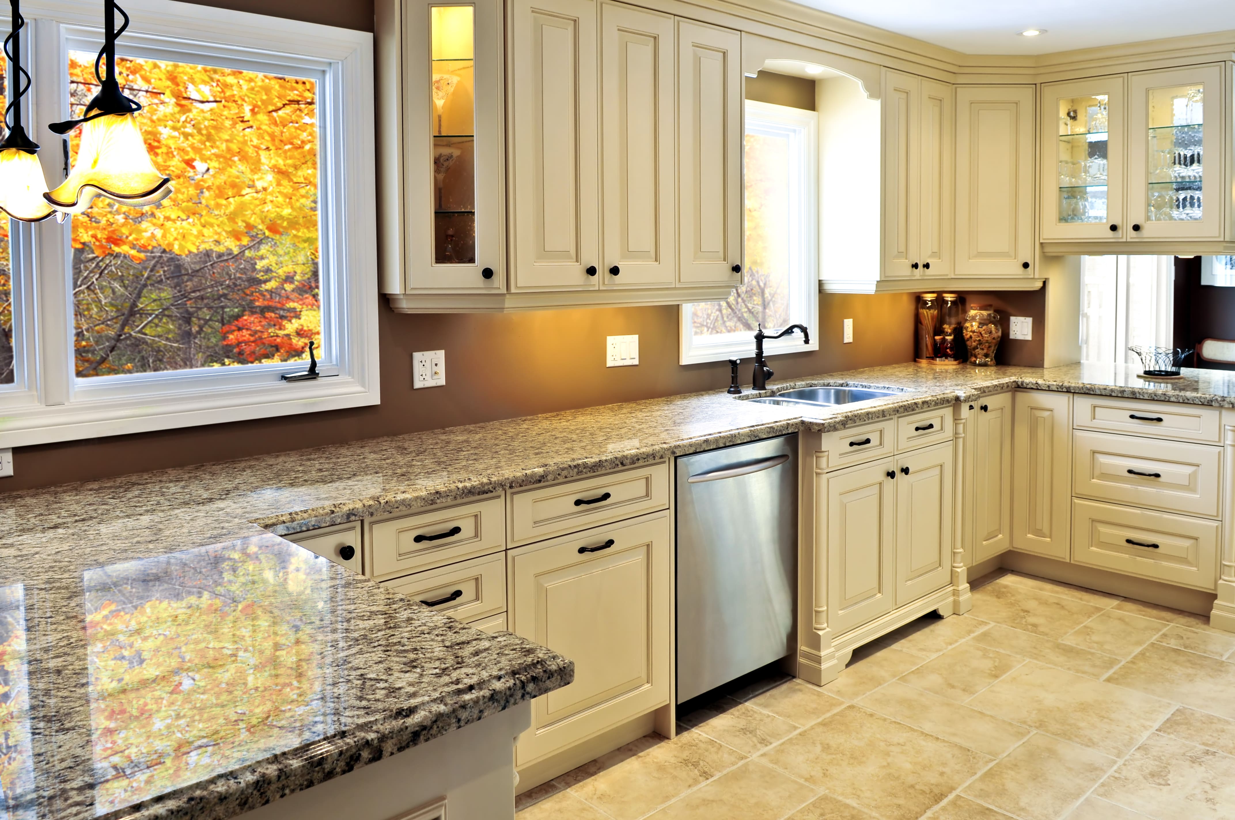 a kitchen with granite counter tops and a sink