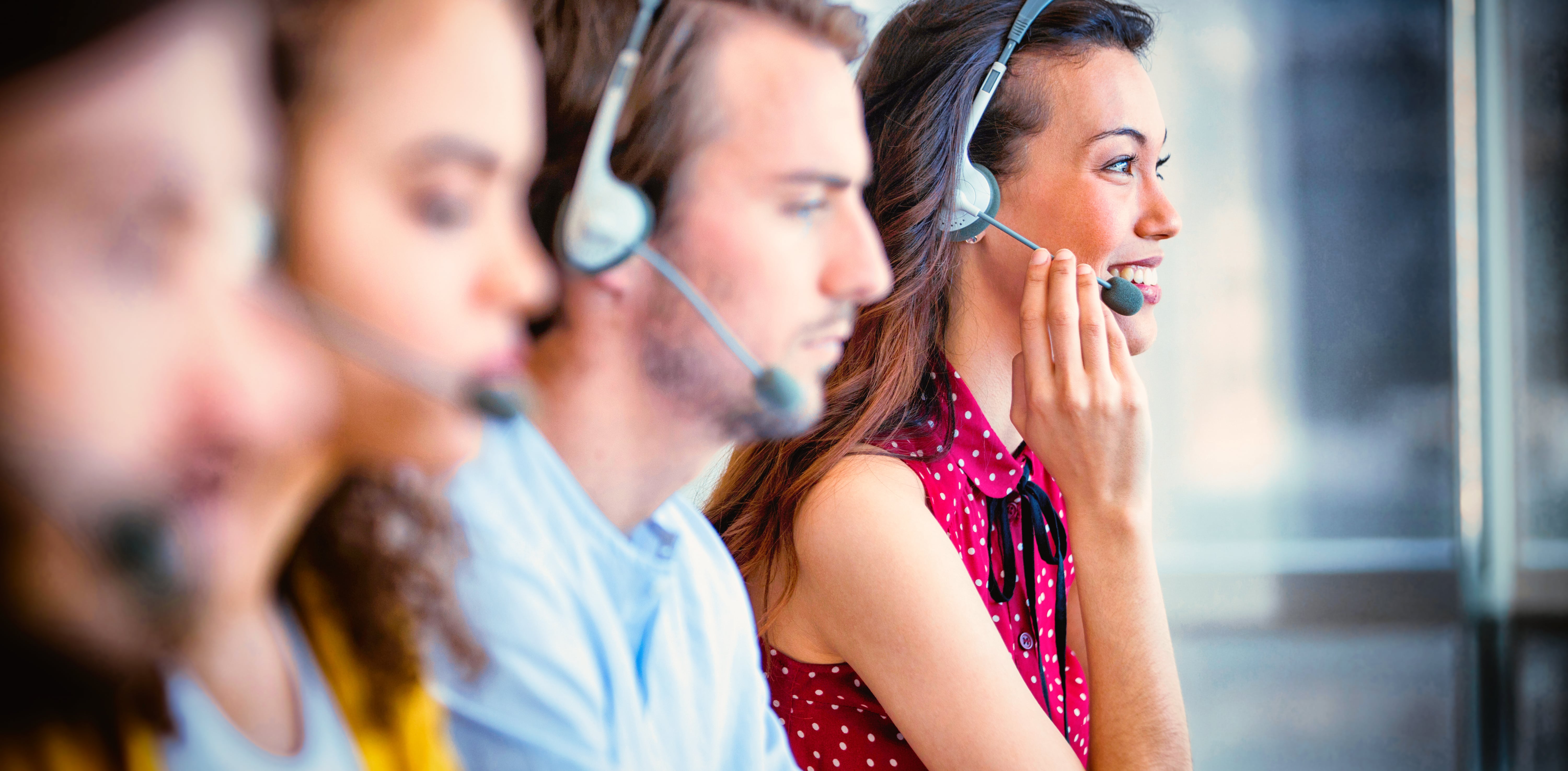 a group of people wearing headsets