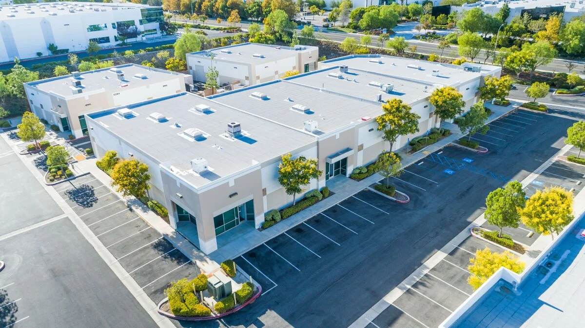 a commercial building with parking spaces