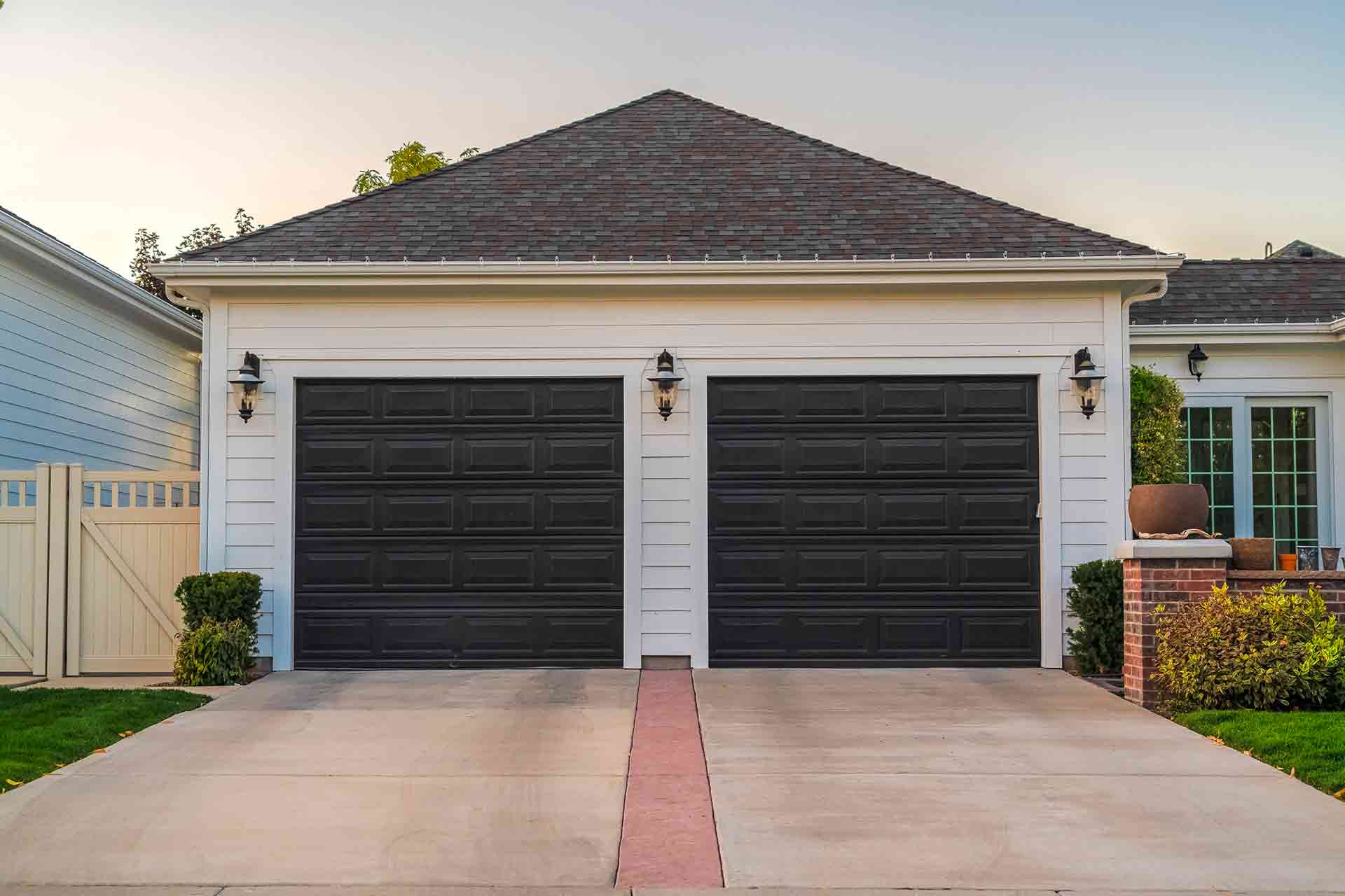 a garage with shingle roofing