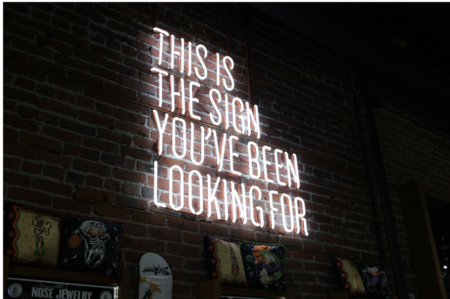 Neon sign that reads : 'this is the sign you've been looking for' Neon sign that reads : 'this is the sign you've been looking for'