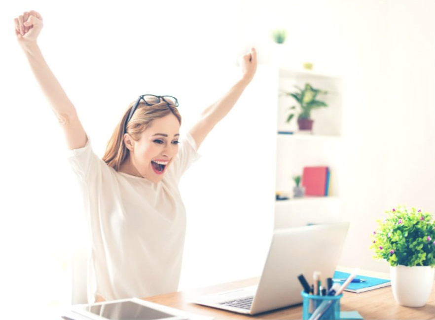 Business woman celebrating at her laptop Business woman celebrating at her laptop